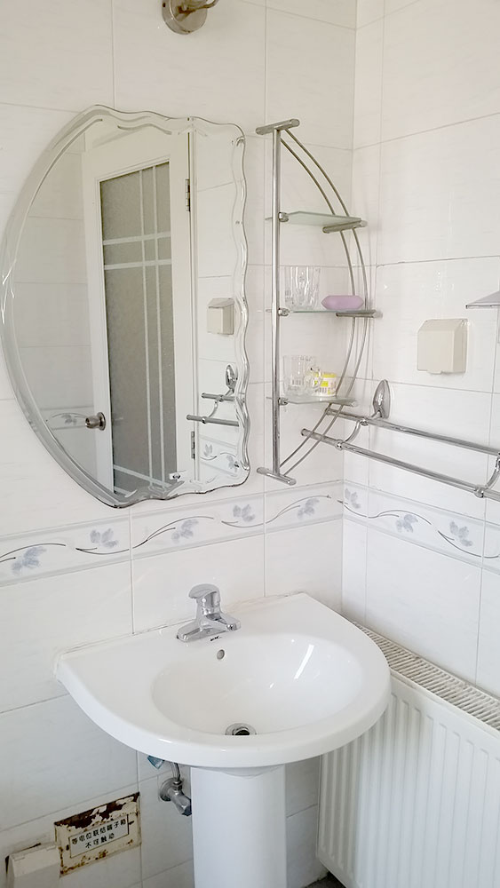 Baño de un apartamento con servicios en Pekín